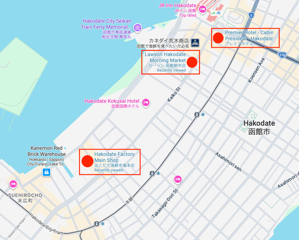 Map of Hakodate Station area with three red pins marking currency exchange locations.